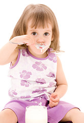 Image showing little girl with yogurt