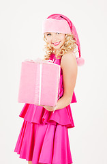 Image showing cheerful santa helper girl with gift box