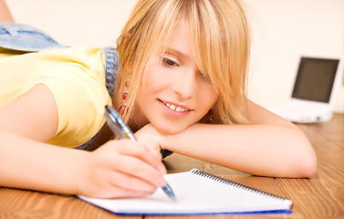 Image showing teenage girl with notebook and pen