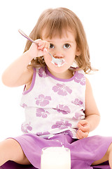 Image showing little girl with yogurt