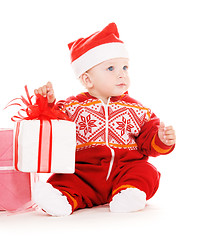 Image showing santa helper baby with christmas gifts