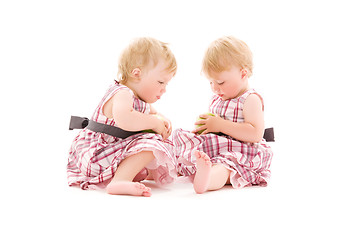 Image showing two adorable twins over white