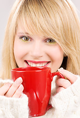 Image showing happy teenage girl with red mug