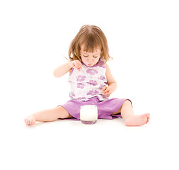 Image showing little girl with yogurt