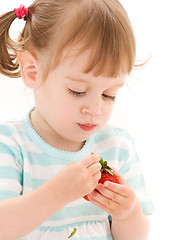 Image showing little girl with strawberry