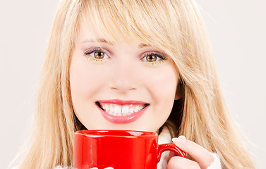 Image showing happy teenage girl with red mug