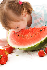Image showing little girl with strawberry and watermelon