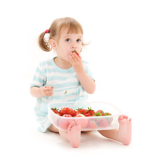 Image showing little girl with strawberry