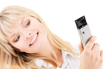 Image showing happy woman using phone camera