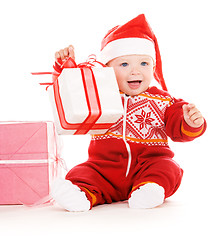 Image showing santa helper baby with christmas gifts