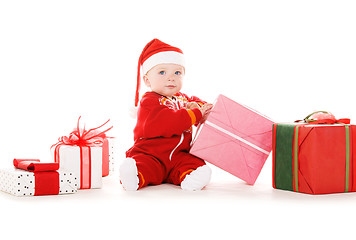 Image showing santa helper baby with christmas gifts