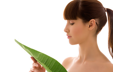 Image showing woman with green leaf