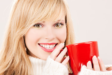 Image showing happy teenage girl with red mug