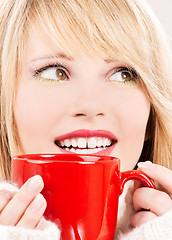 Image showing happy teenage girl with red mug