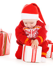 Image showing santa helper baby with christmas gifts