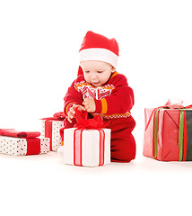 Image showing santa helper baby with christmas gifts