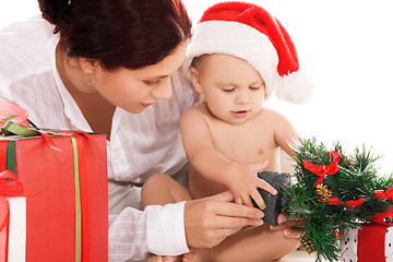 Image showing baby and mother with christmas gifts