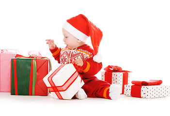 Image showing santa helper baby with christmas gifts