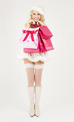 Image showing santa helper with pink shopping bags