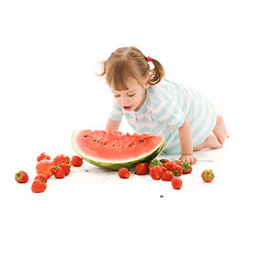 Image showing little girl with strawberry and watermelon