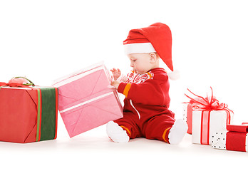 Image showing santa helper baby with christmas gifts