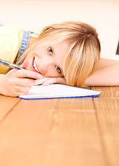 Image showing teenage girl with notebook and pen