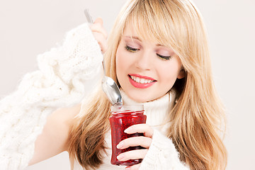 Image showing happy teenage girl with raspberry jam