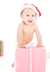 Image showing santa helper baby with christmas gifts