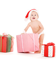 Image showing santa helper baby with christmas gifts