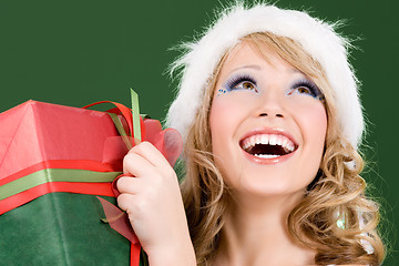 Image showing happy santa helper with gift box