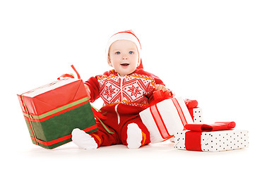 Image showing santa helper baby with christmas gifts