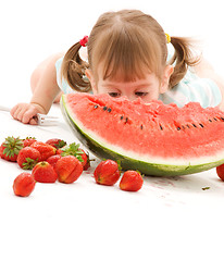 Image showing little girl with strawberry and watermelon