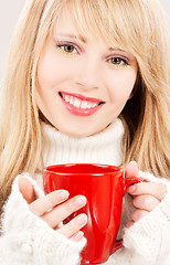 Image showing happy teenage girl with red mug