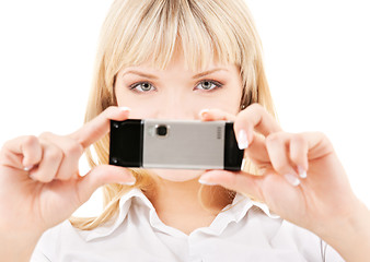 Image showing happy woman using phone camera