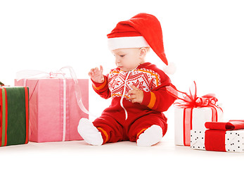 Image showing santa helper baby with christmas gifts