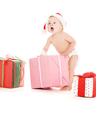 Image showing santa helper baby with christmas gifts