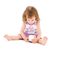 Image showing little girl with glass of yoghurt