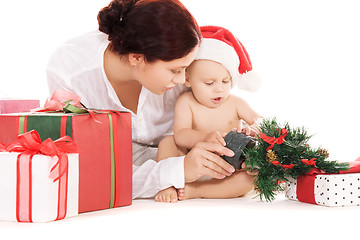 Image showing baby and mother with christmas gifts