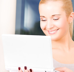 Image showing happy businesswoman with laptop computer