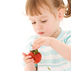 Image showing little girl with strawberry