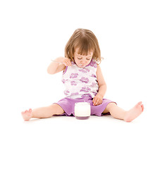 Image showing little girl with yogurt