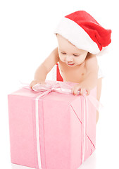 Image showing santa helper baby with christmas gifts