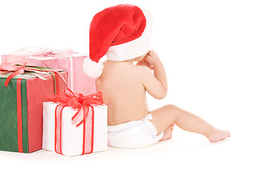 Image showing santa helper baby with christmas gifts