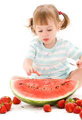 Image showing little girl with strawberry and watermelon