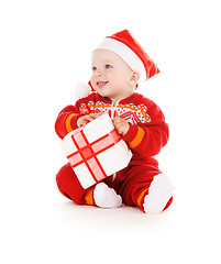 Image showing santa helper baby with christmas gift