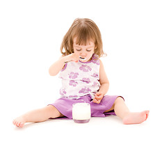 Image showing little girl with yogurt