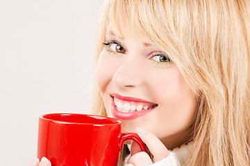 Image showing happy teenage girl with red mug