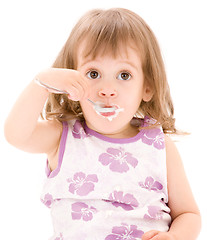 Image showing little girl with yogurt