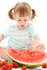 Image showing little girl with strawberry and watermelon