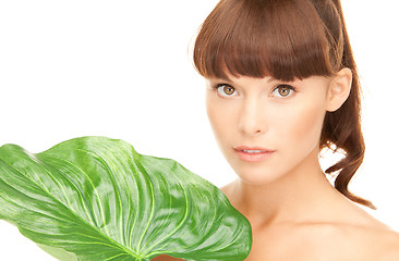 Image showing woman with green leaf